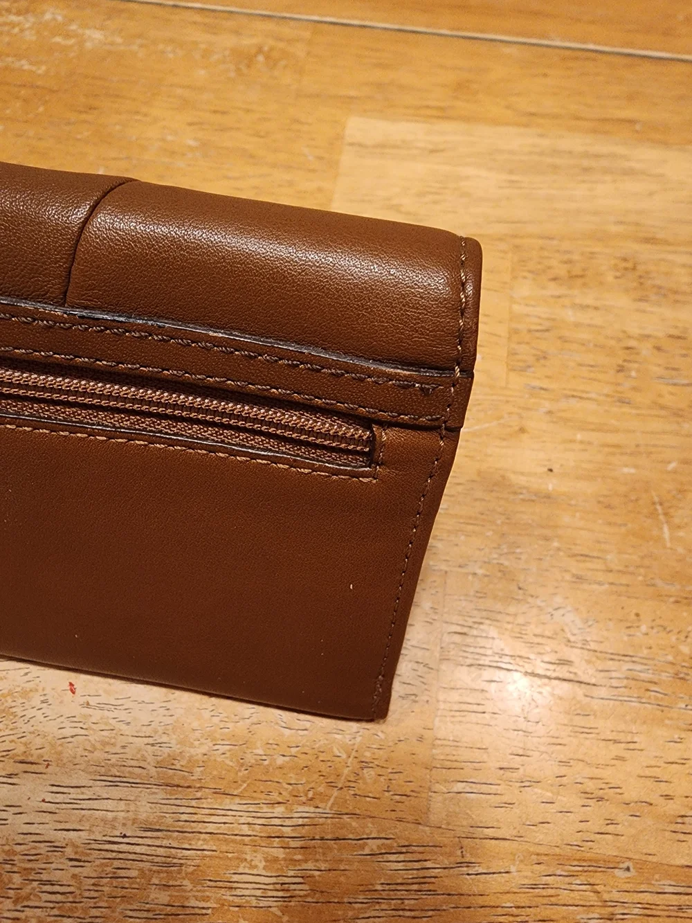 vintage Coach Soho Buckle Wallet crafted in brown leather prominent front Buckle